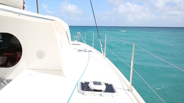 Catamaran sailing in caribbean water