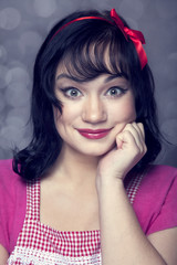 Surprised brunette housewife