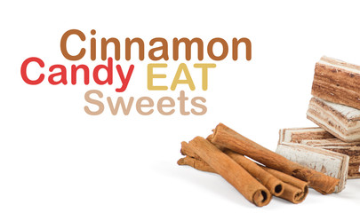 Sweets and cinnamon sticks isolated on white background