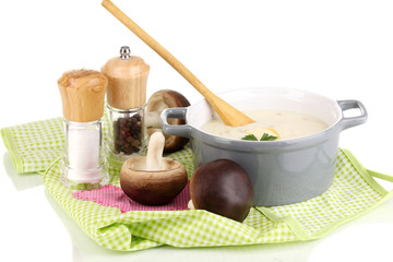 Mashed potatoes in saucepan with ingredients isolated on white