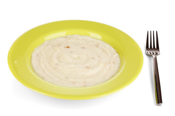 Mashed potatoes in green plate isolated on white