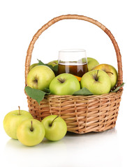 Useful apple juice with apples around in basket isolated