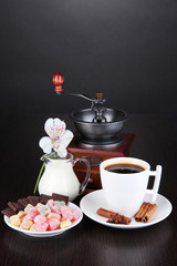 Cup of coffee with rahat delight, milk and coffee mill