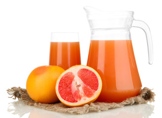 Full glass and jug of grapefruit juice and grapefruits isolated