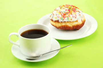 Tasty donuts on color plate on color background