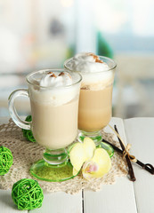 Fragrant coffee latte in glasses cups with spices,