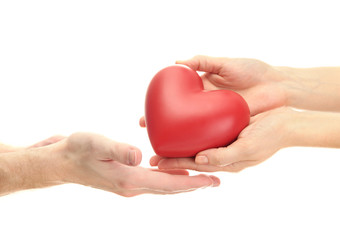 Obraz premium Red heart in woman and man hands, isolated on white