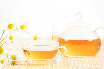 teacup with herbal chamomile tea