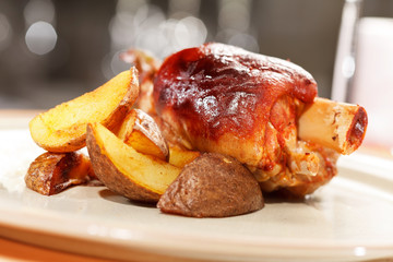 roasted pork knuckle with potatoes