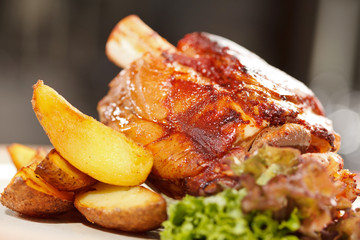 roasted pork knuckle with potatoes