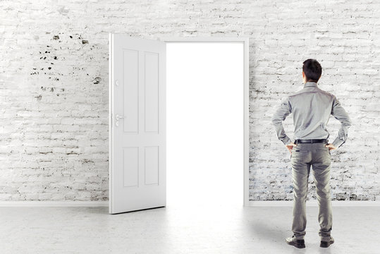 Young Business Man In Front Of An Open Door