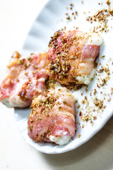 grilled bacon around sheep cheese