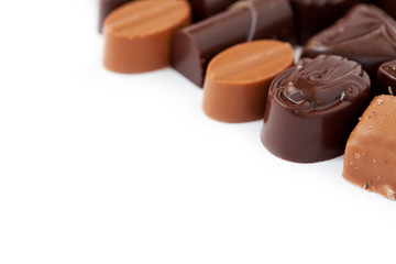Variety of chocolate pralines on white