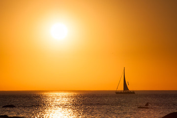 Sailing boat with beautiful sunset