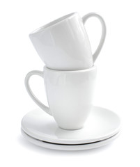 Empty white coffee cups and saucers on white background