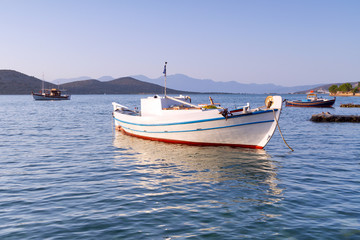 White Greek boat at the coast of Crete