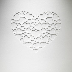 Obraz na płótnie Canvas Serce Walentynki z małych serc na karcie papieru