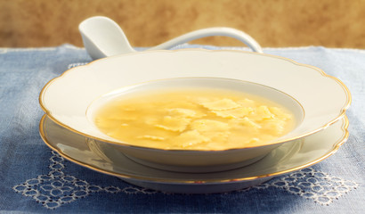 warm broth with ravioli
