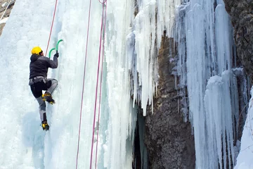 Gardinen Ice climbing the waterfall. © vetal1983