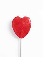Heart shaped lollipop isolated on white