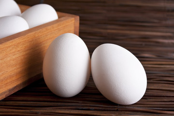 Organic eggs in wooden box
