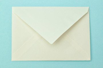 Simple postal envelope on a blue background.