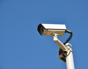 IR surveillance camera against blue sky