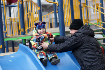 Grandfather playing with toddler