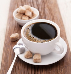 Cup of coffee with brown sugar.