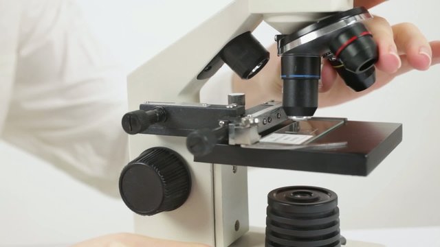 Scientist with microscope