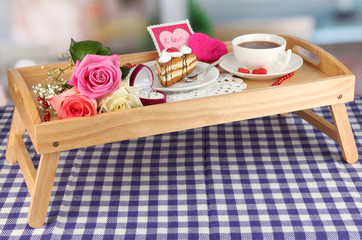 Breakfast in bed on Valentine's Day on room background