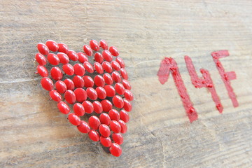 Red heart on wodden  background