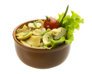 Marinated mushrooms in white saucer isolated on white