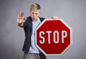 Man showing stop sign.