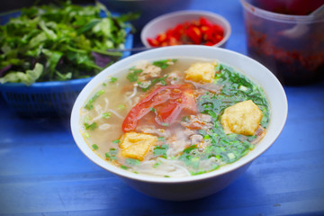 Vegetarian Soup with fried tofu, tomato and scallion
