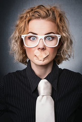 Woman with adhesive bandage over her mouth