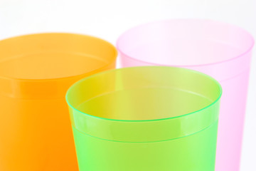 Green, orange and pink cups