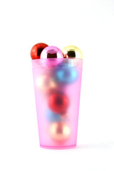 Color christmas decorations (balls) in cup