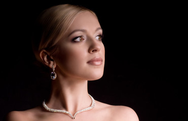 young woman with makeup in luxury jewelry