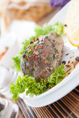 flavored piece of meat cooked in the oven