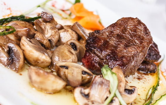 Beef steak with tasty mushrooms and truffle oil