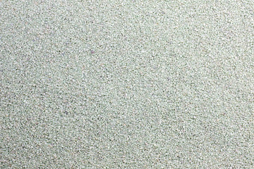 Sand and pebbles closeup background texture