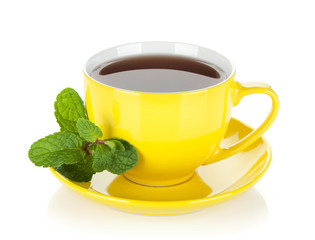 Yellow tea cup with mint