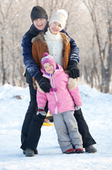 Family walking in a winter park