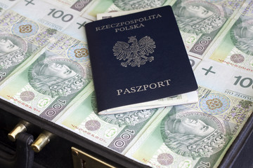Suitcase passport and polish money corruption and escape concept