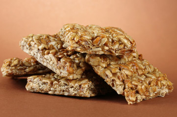 tasty sweets (kozinaki), on brown background