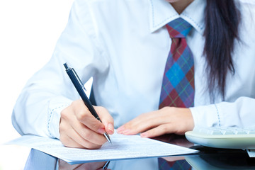 girl at work in the office. sign documents