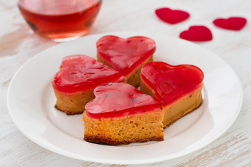 cakes with glass of pink wine