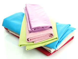 heap of cloth fabrics isolated on white