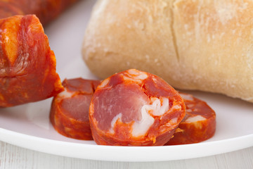 chorizo with bread on the plate